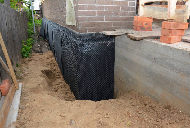 Happy homeowners after waterproofing job in Kipton